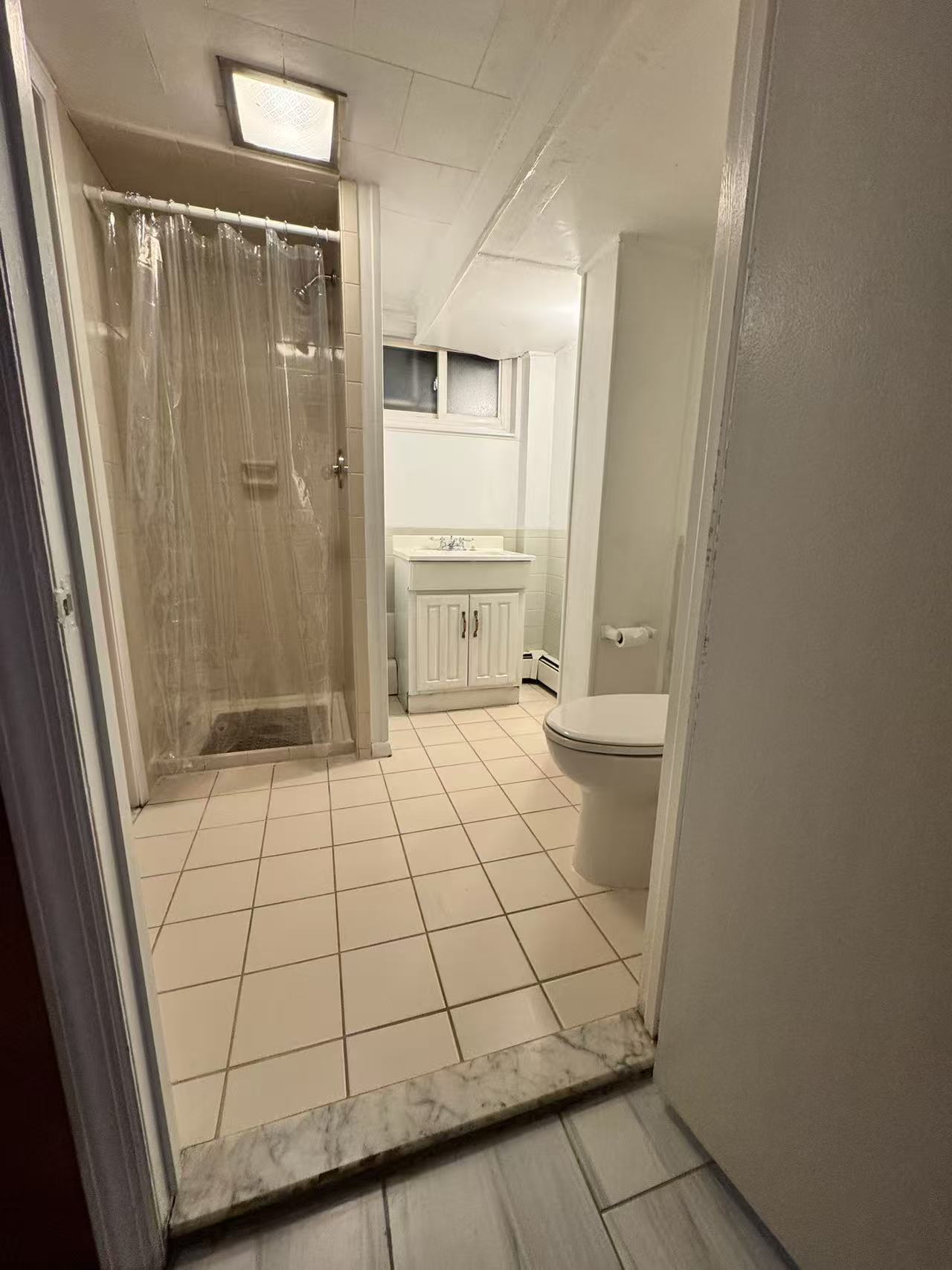 Bathroom with stall shower and vanity
